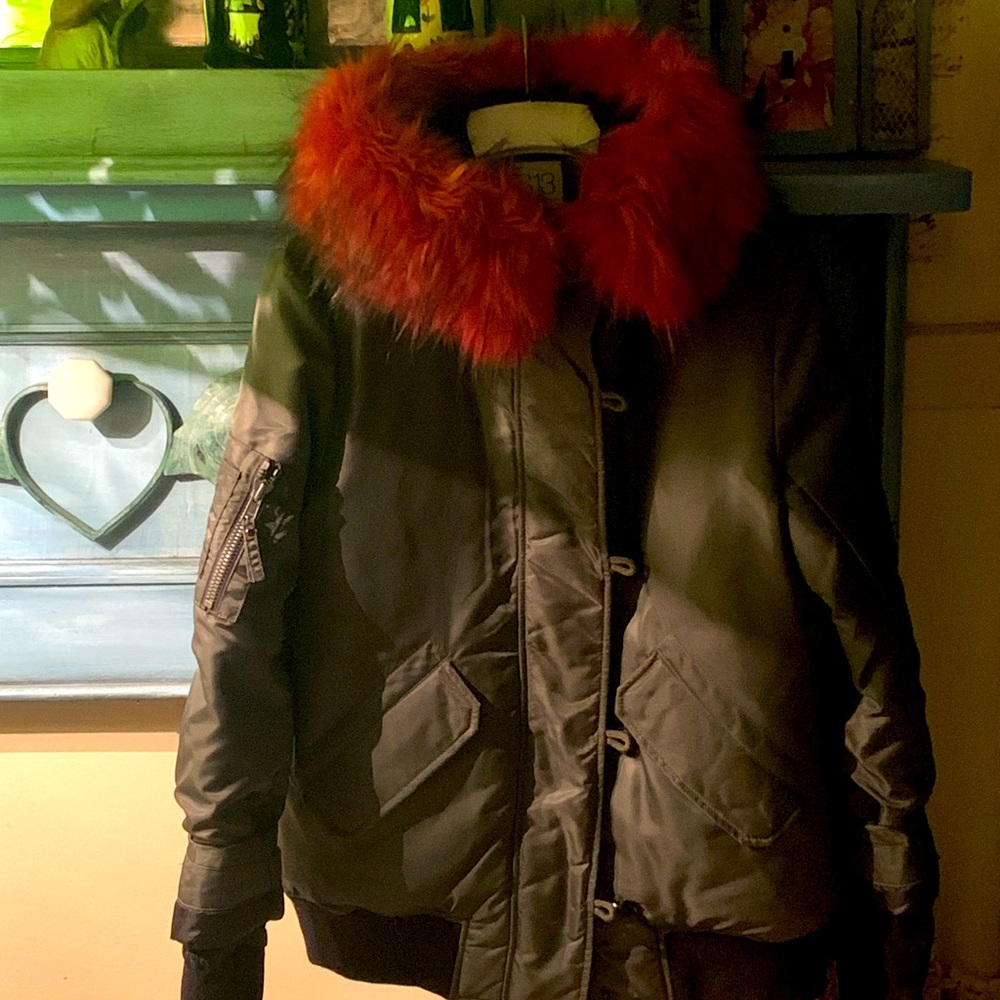 Brand new, hooded faux fur in fushia Inside cuffs with thumb holes.Duck down